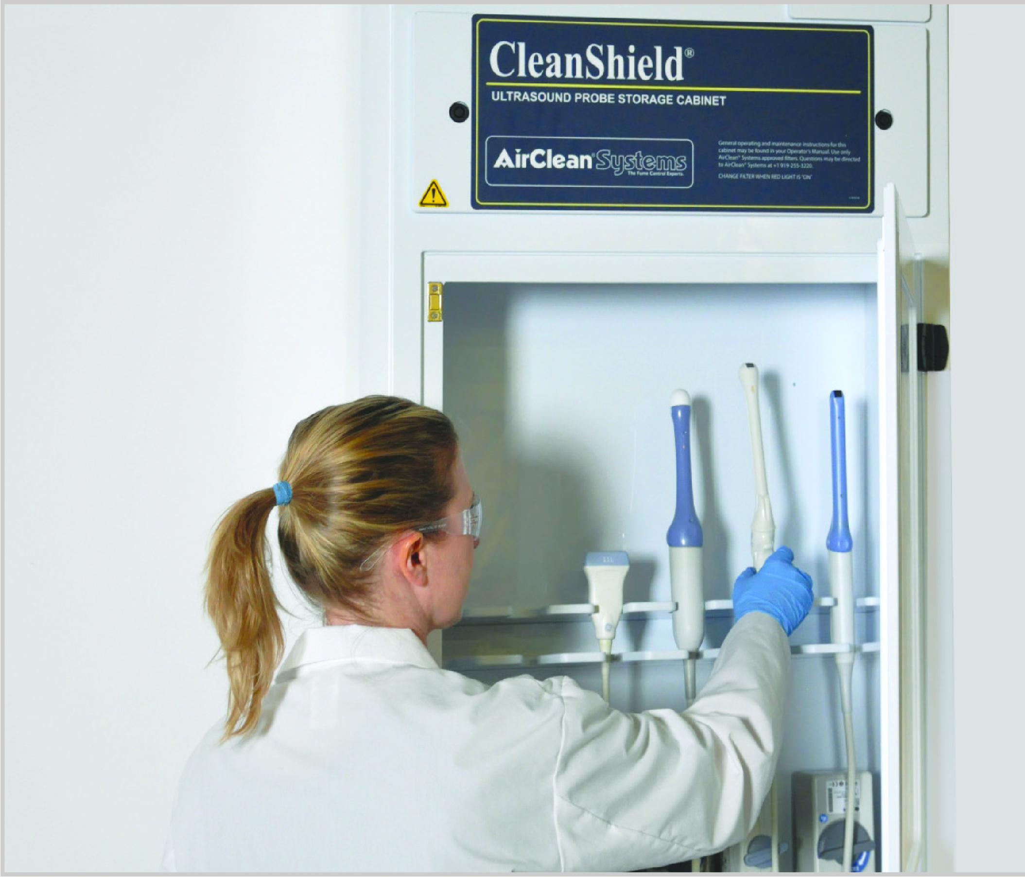 Technician storing probes in a cabinet
